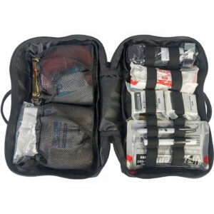 Open black first aid kit with various bandages and medical supplies.